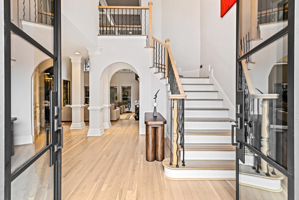 Refinished white oak floor in cool NordicSeal neutral running through the main living area — Hoschton, GA