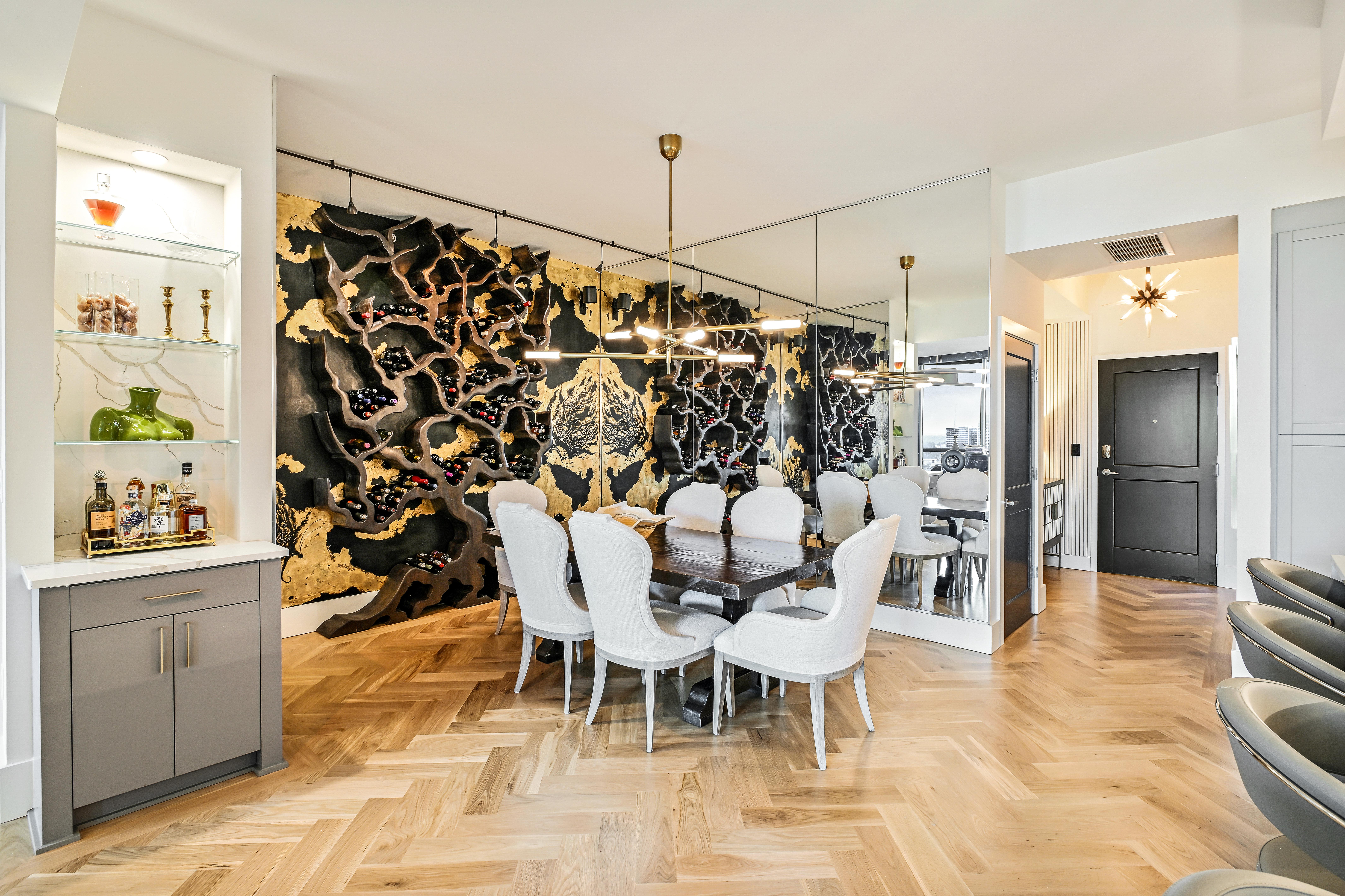 Custom white oak herringbone installation with integrated border for a Buckhead high-rise residence.