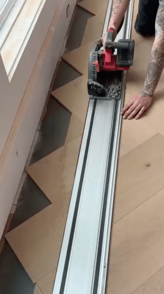 Cutting border pieces for custom herringbone installation with prefinished engineered oak flooring in Atlanta