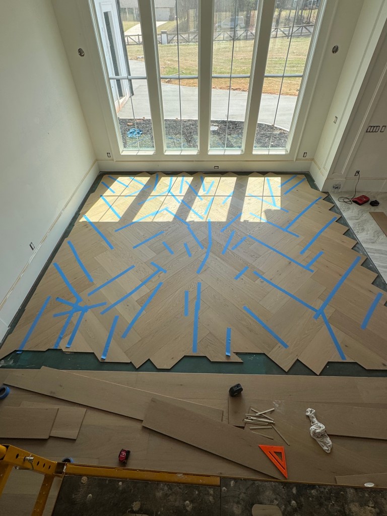 Custom herringbone installation using prefinished engineered oak flooring in Atlanta