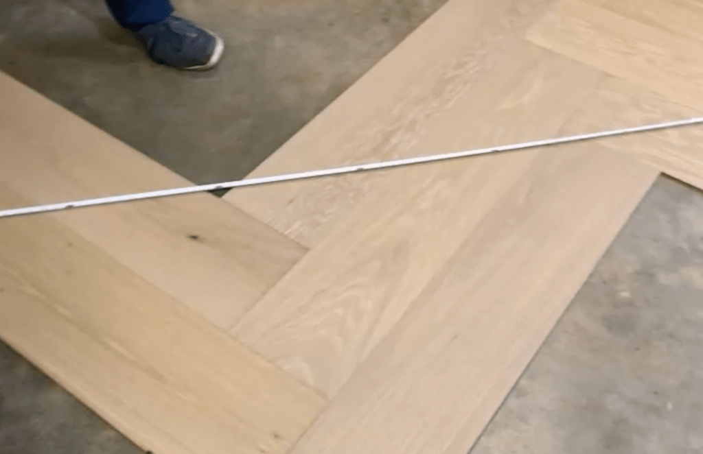 Mock-up for custom herringbone and border installation using prefinished engineered oak flooring in Atlanta
