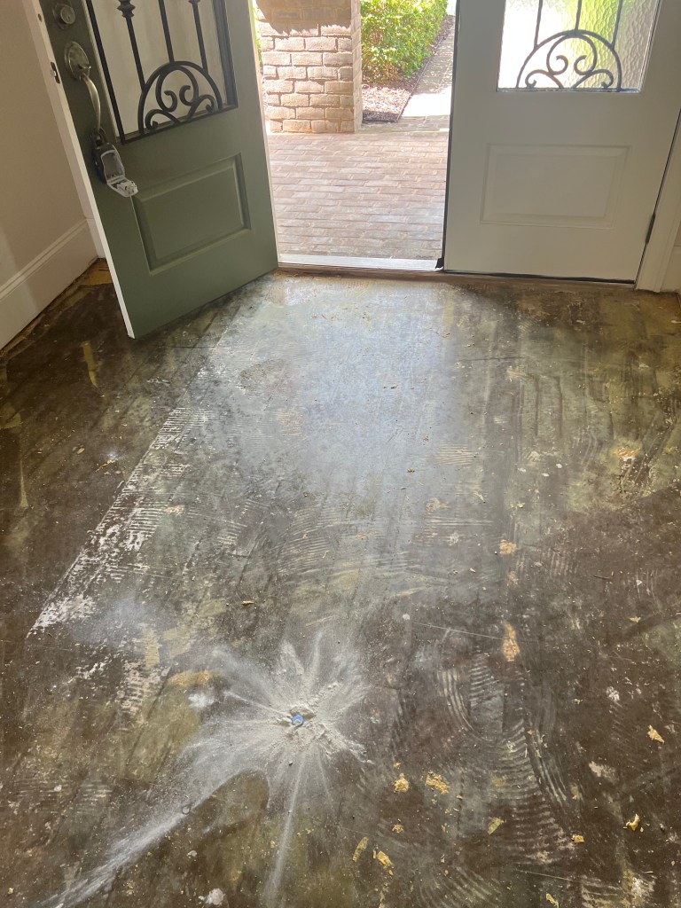 Concrete slab after old floor removal and grinding — pre-installation subfloor preparation, Chateau Elan, Braselton GA