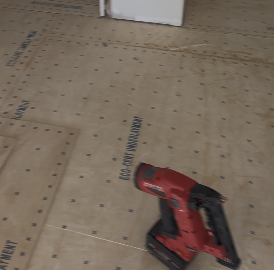 Plywood subfloor fastened with a high-density screw pattern during hardwood installation preparation by Classy Flooring ATL in Atlanta