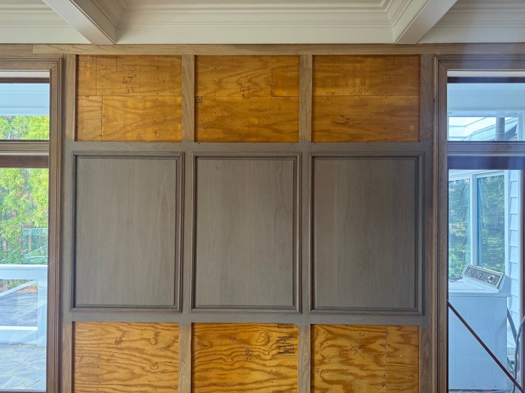 Three Rubio Monocoat gray-greige samples installed side-by-side for in-context color review — Buckhead paneling project