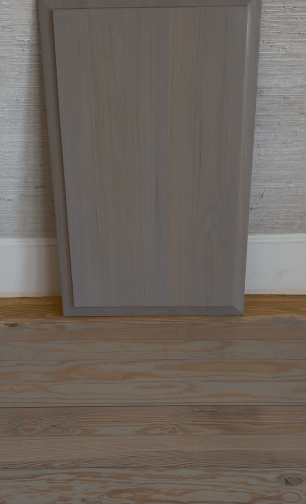 Rubio Monocoat Linen sample panel placed on upstairs pine floor for whole-home color coordination, Buckhead residence.