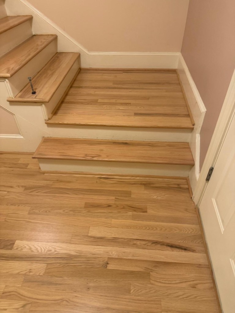 Finished red oak stair treads and landing after refinishing in Atlanta, two coats of Bona NaturalSeal and two coats of Bona Traffic HD satin
